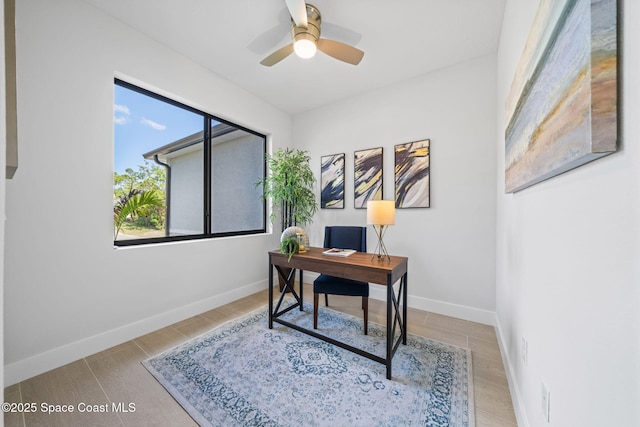 office space with ceiling fan and light wood-type flooring