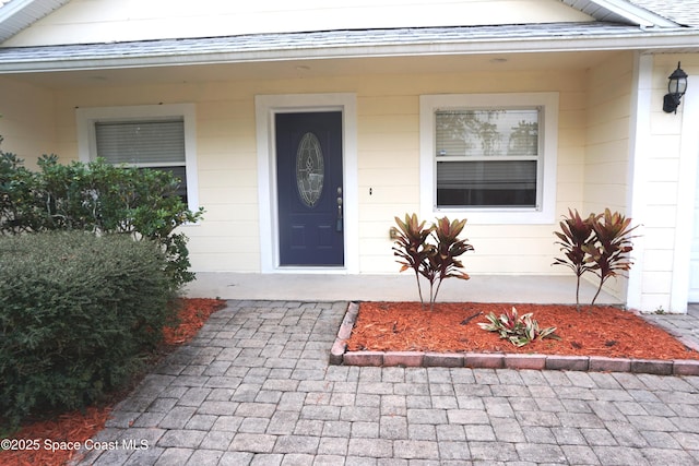 doorway to property with covered porch