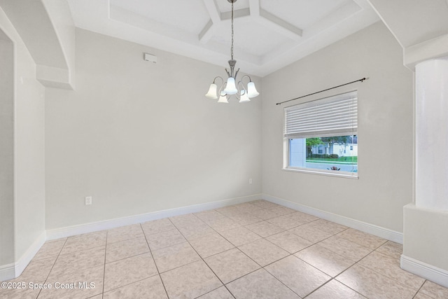 tiled spare room with an inviting chandelier, coffered ceiling, and beam ceiling