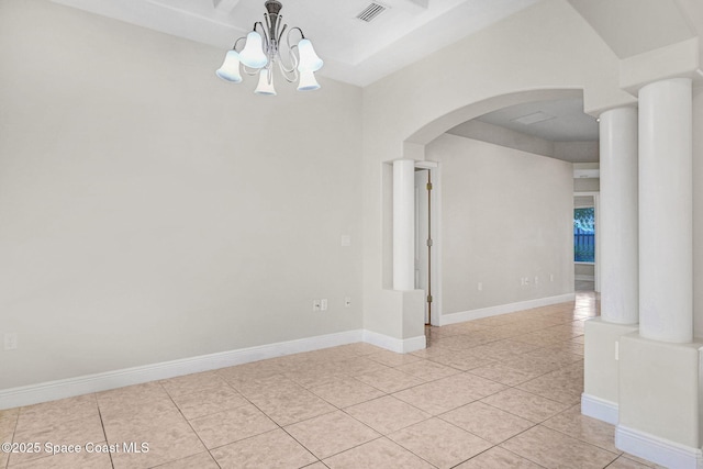 empty room featuring light tile patterned floors and an inviting chandelier