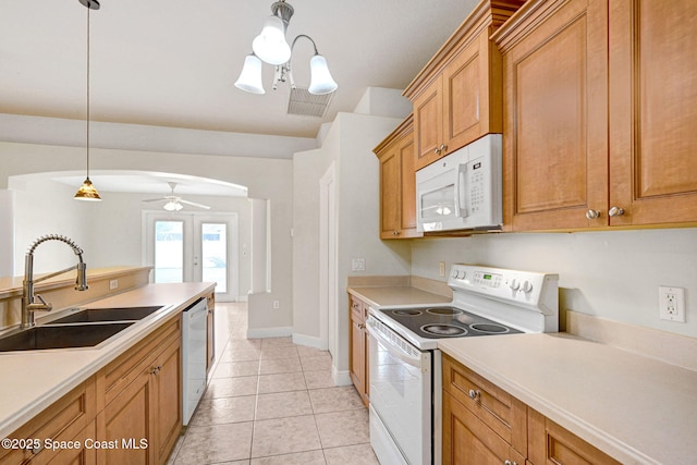 kitchen featuring sink, white appliances, light tile patterned floors, ceiling fan, and decorative light fixtures