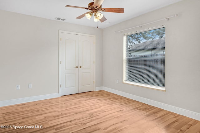 spare room with ceiling fan and light hardwood / wood-style flooring