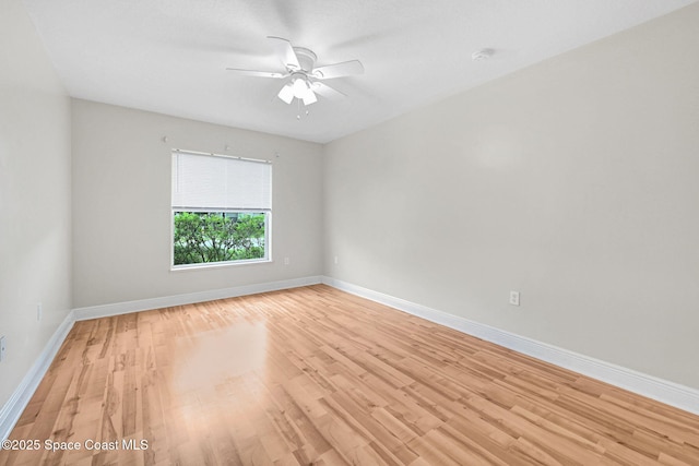 spare room featuring ceiling fan and light wood-type flooring