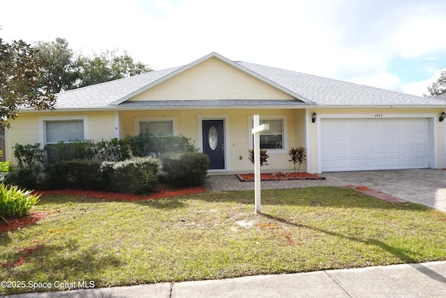 single story home with a garage and a front yard