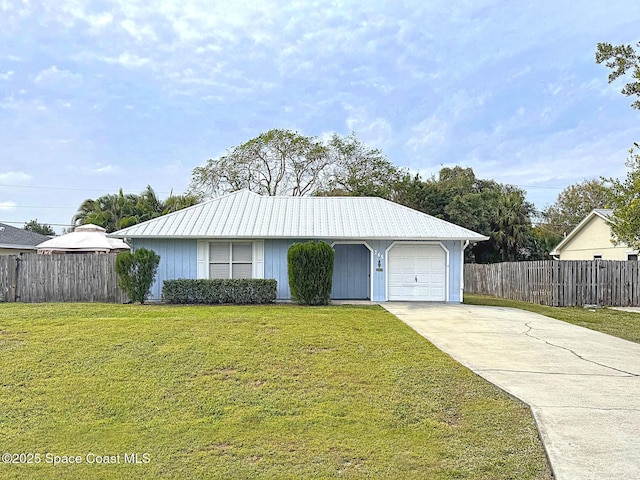 ranch-style house featuring a garage and a front lawn