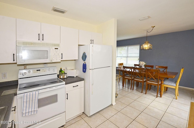 kitchen featuring light tile patterned floors, white cabinets, white appliances, and decorative light fixtures