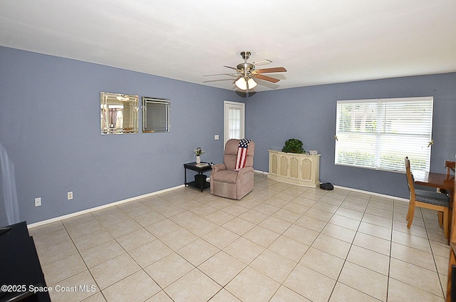 unfurnished room featuring ceiling fan and light tile patterned floors