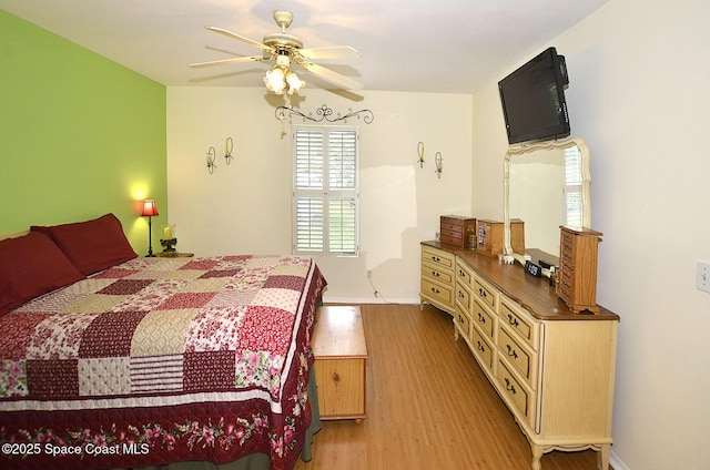 bedroom featuring light hardwood / wood-style flooring and ceiling fan