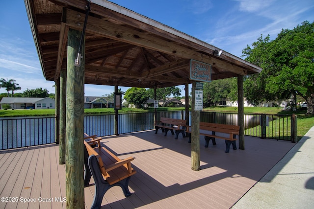 view of dock featuring a gazebo and a deck with water view