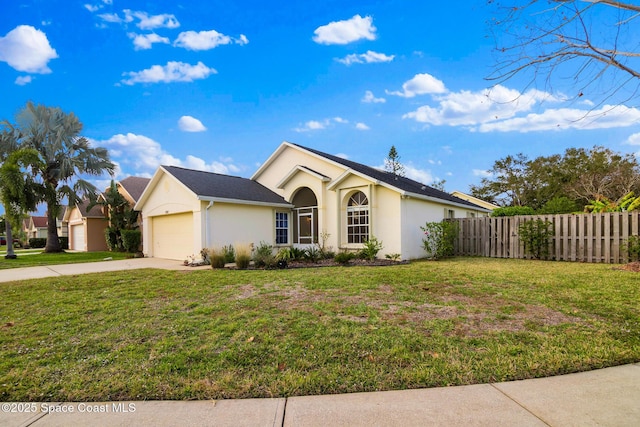 ranch-style house with a garage and a front yard