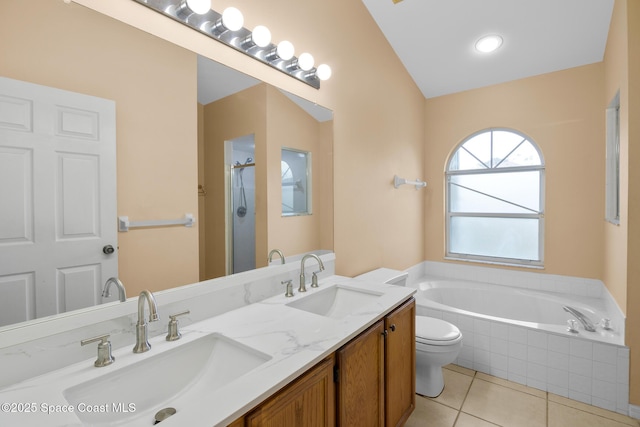 full bathroom with tile patterned flooring, vanity, plus walk in shower, and toilet