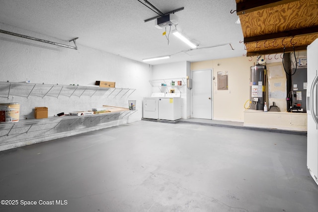 garage featuring electric panel, a garage door opener, washer and clothes dryer, and water heater