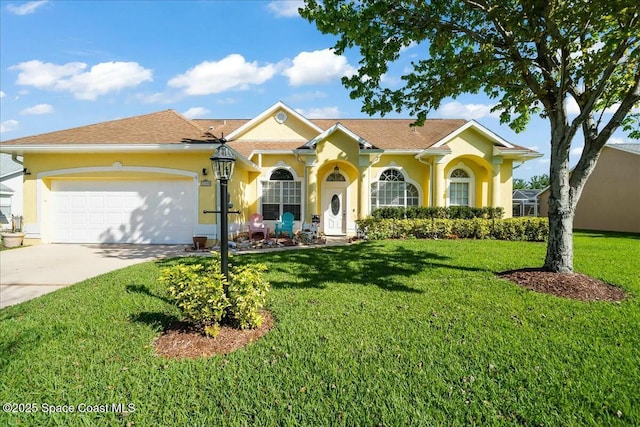 view of front of property featuring a garage and a front lawn