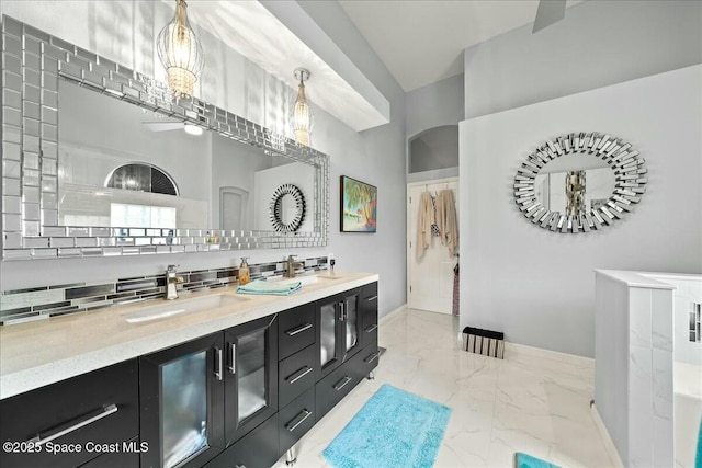 bathroom with vanity and decorative backsplash