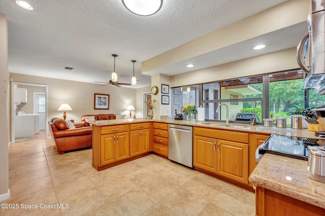 kitchen featuring pendant lighting, sink, light stone counters, stainless steel dishwasher, and kitchen peninsula