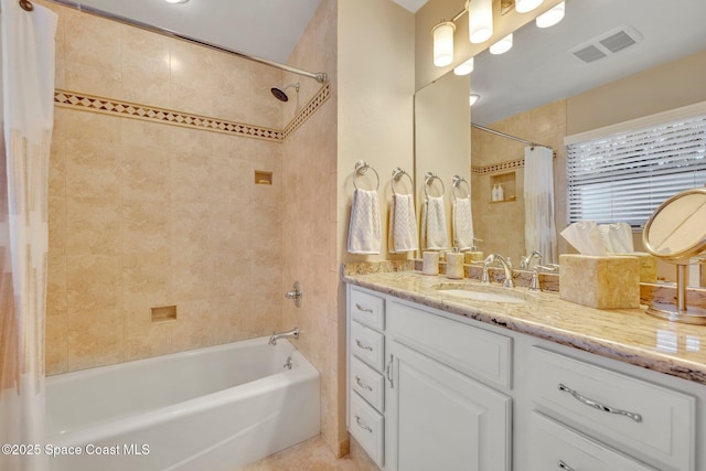 bathroom featuring vanity and shower / tub combo with curtain