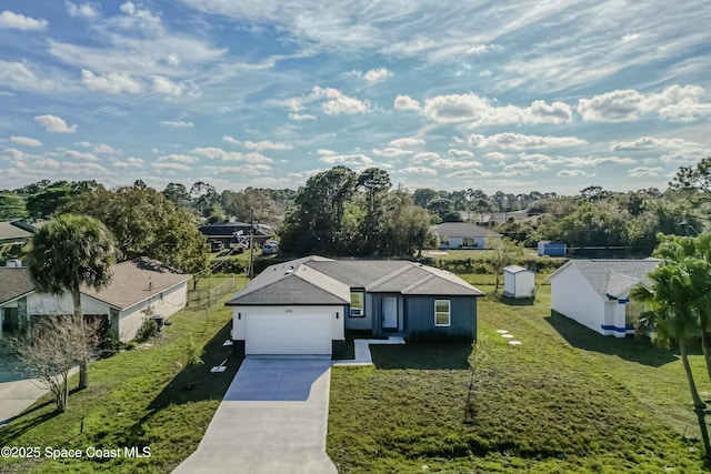 view of front of property featuring a garage and a front lawn