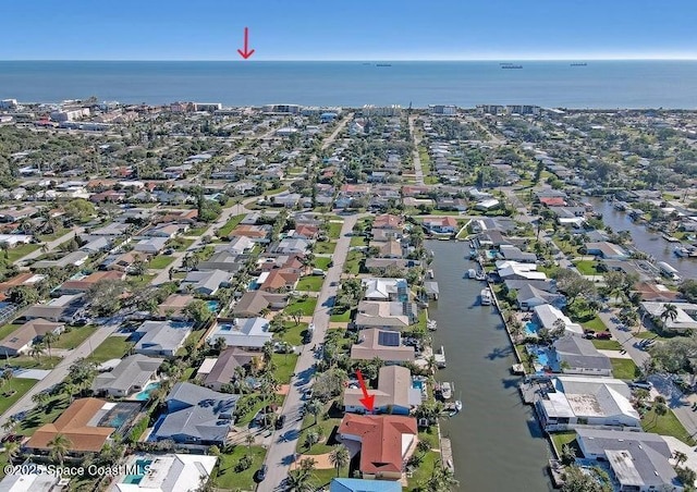 birds eye view of property featuring a water view