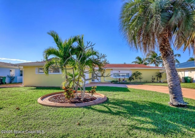 view of front of property with a front lawn