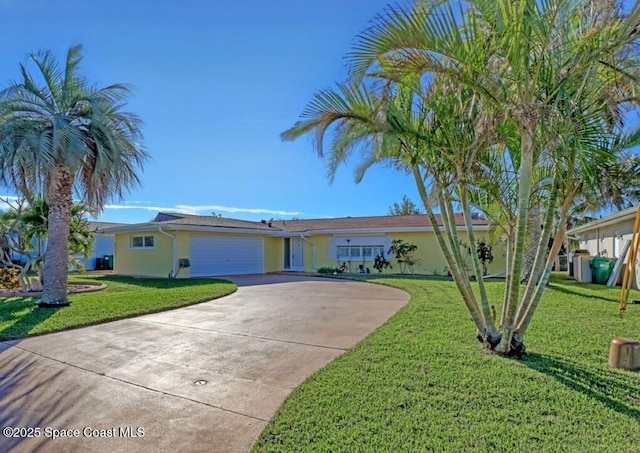 single story home featuring a garage and a front lawn