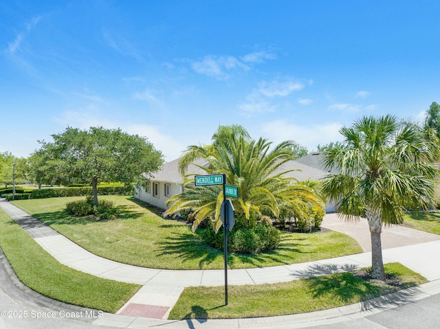 7105 Mendell Way, Melbourne, FL 32940 - surrounding community featuring a lawn
