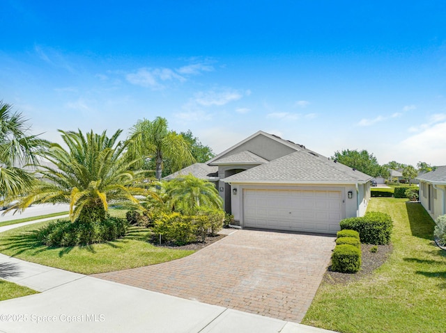 7105 Mendell Way, Melbourne, FL 32940 - single story home with stucco siding, an attached garage, a front lawn, and decorative driveway