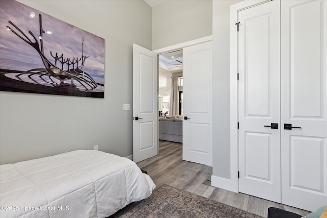 bedroom featuring a closet and light hardwood / wood-style flooring