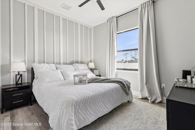 bedroom featuring hardwood / wood-style floors and ceiling fan