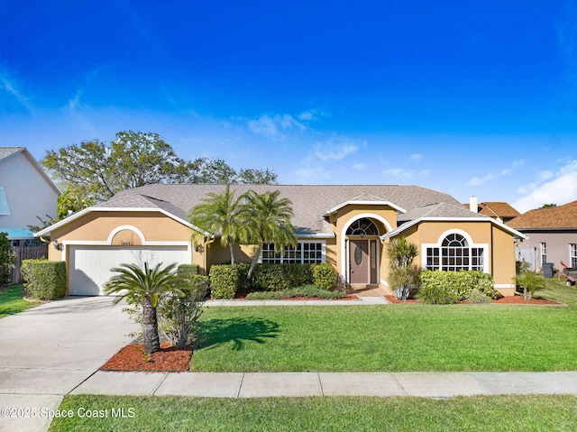 ranch-style home with a garage and a front lawn