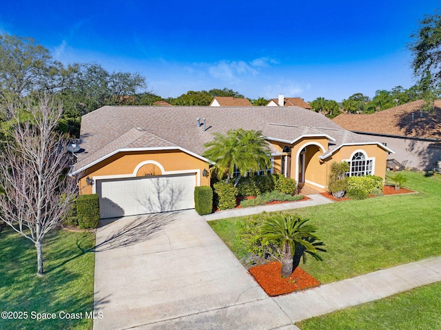 single story home featuring a garage and a front lawn