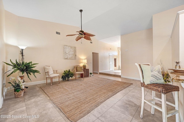 sitting room featuring light tile patterned flooring, ceiling fan, and lofted ceiling