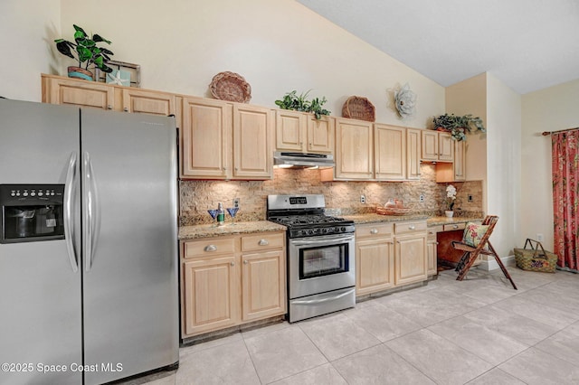 kitchen with light stone counters, light brown cabinetry, decorative backsplash, and stainless steel appliances