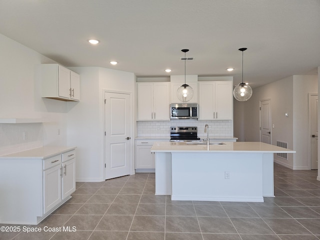 kitchen with stainless steel appliances, white cabinetry, sink, and pendant lighting