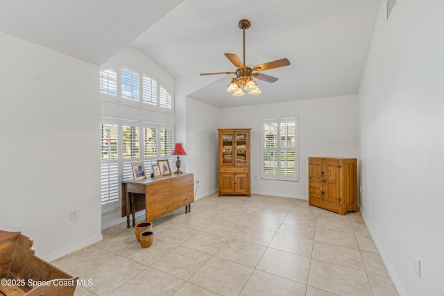 interior space with lofted ceiling and ceiling fan