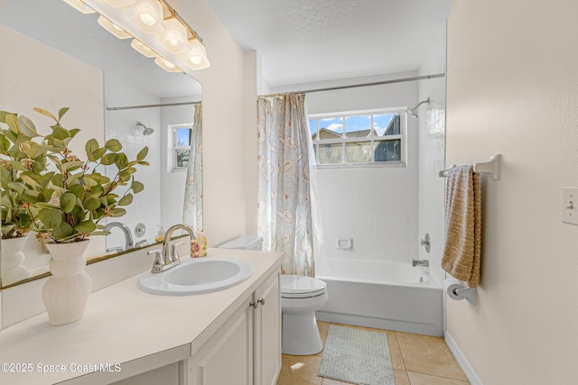 full bathroom with shower / bath combination with curtain, tile patterned flooring, vanity, toilet, and a textured ceiling