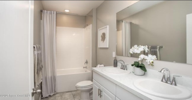 full bathroom with shower / bath combo, vanity, tile patterned floors, and toilet