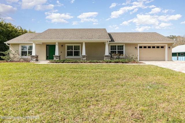 view of front facade with a garage and a front yard