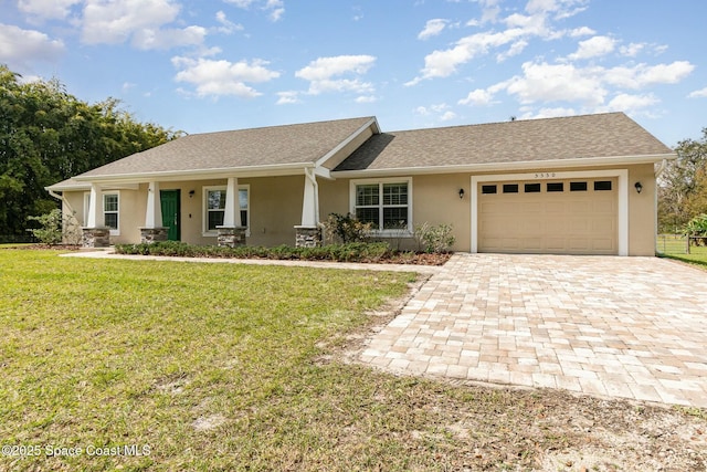 view of front of house with a garage, covered porch, and a front yard