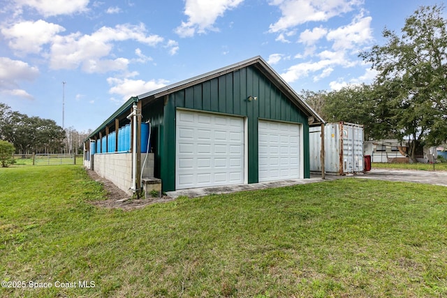 garage with a yard