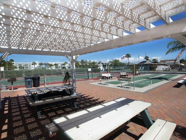 surrounding community featuring tennis court