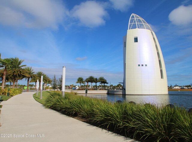 surrounding community featuring a water view