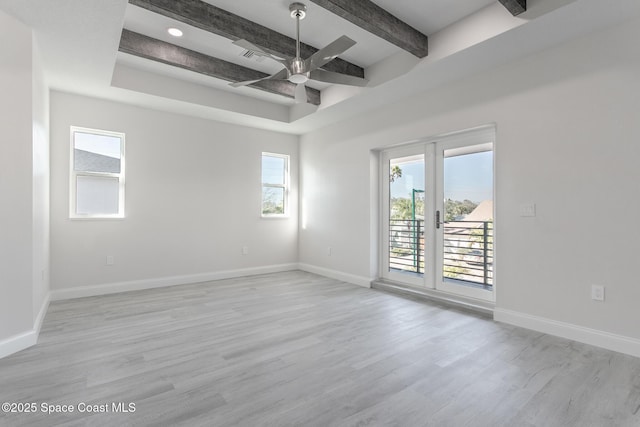 unfurnished room with beamed ceiling, ceiling fan, and light hardwood / wood-style flooring