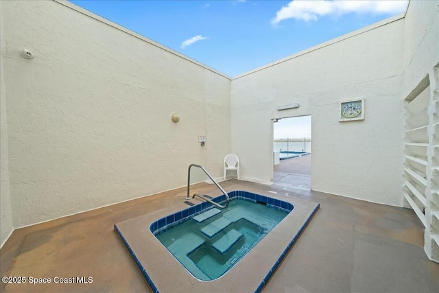 view of pool featuring a community hot tub