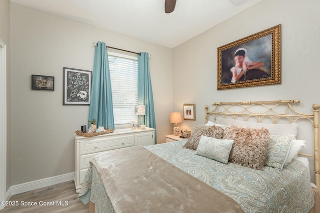 bedroom with ceiling fan and light hardwood / wood-style flooring