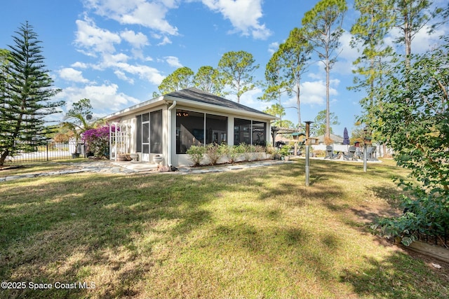 view of yard with a sunroom