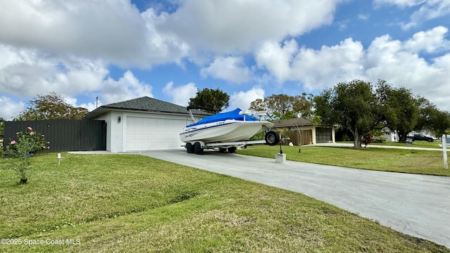 exterior space featuring a garage and a front yard