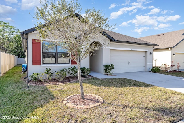 ranch-style house with a garage and a front lawn