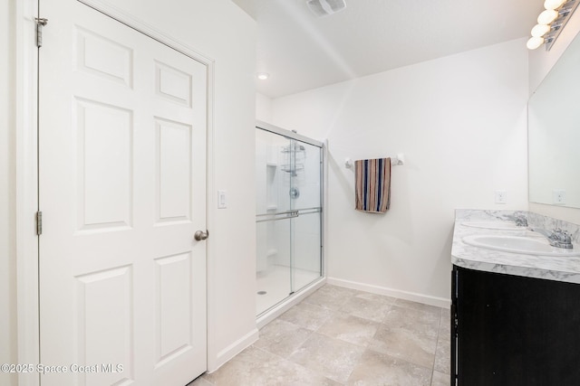 bathroom with vanity and an enclosed shower