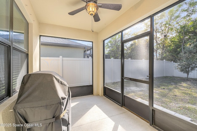 sunroom / solarium with ceiling fan