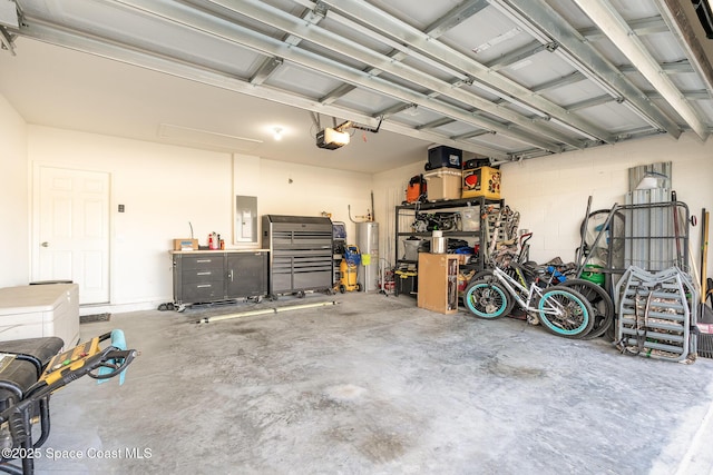 garage with water heater, a garage door opener, and electric panel